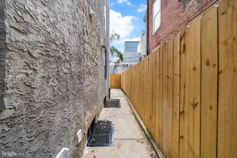 a view of a balcony with wooden walls and stairs
