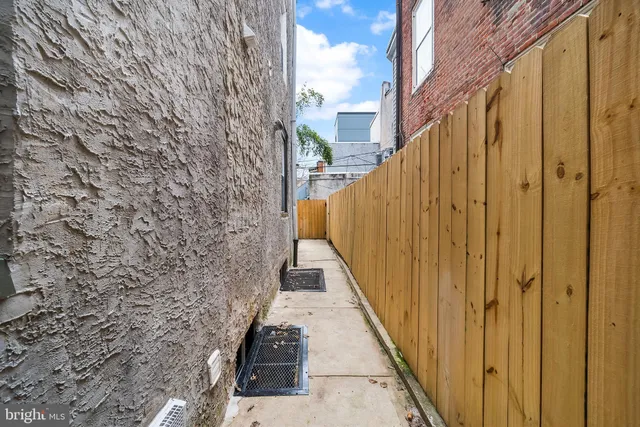 a view of a balcony with wooden walls and stairs
