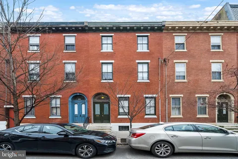 a front view of a house with parking space