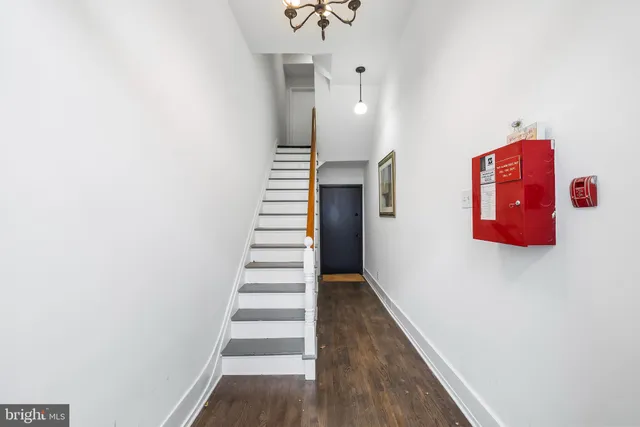a view of a hallway with stairs