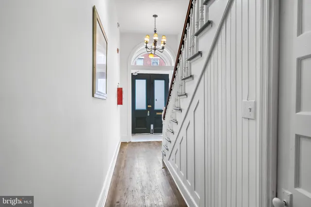 a view of an entryway with wooden floor