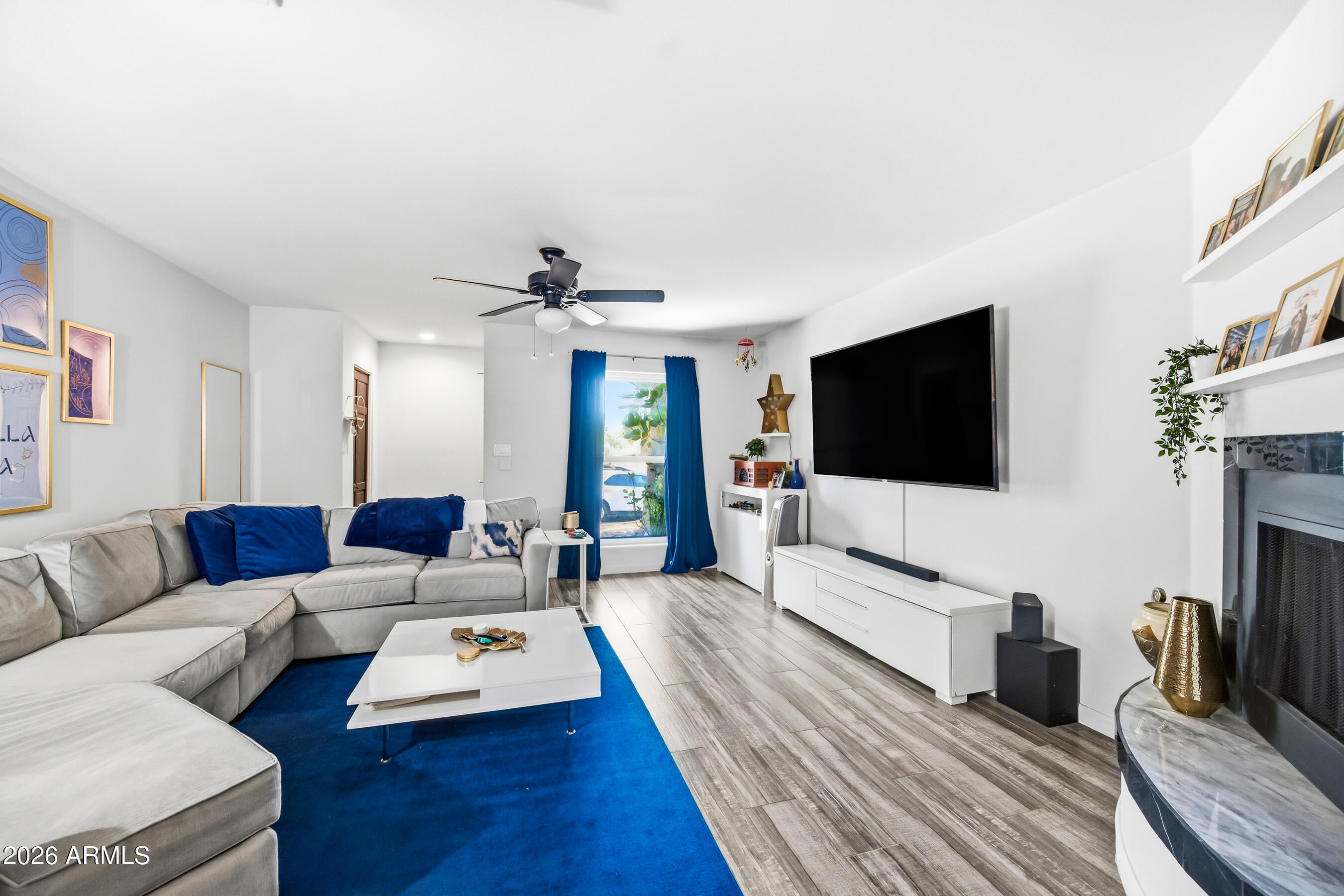 1702 East Ocotillo Road, Unit 1 Phoenix, AZ 85016 - Photo 4 of 27 a living room with furniture and a flat screen tv