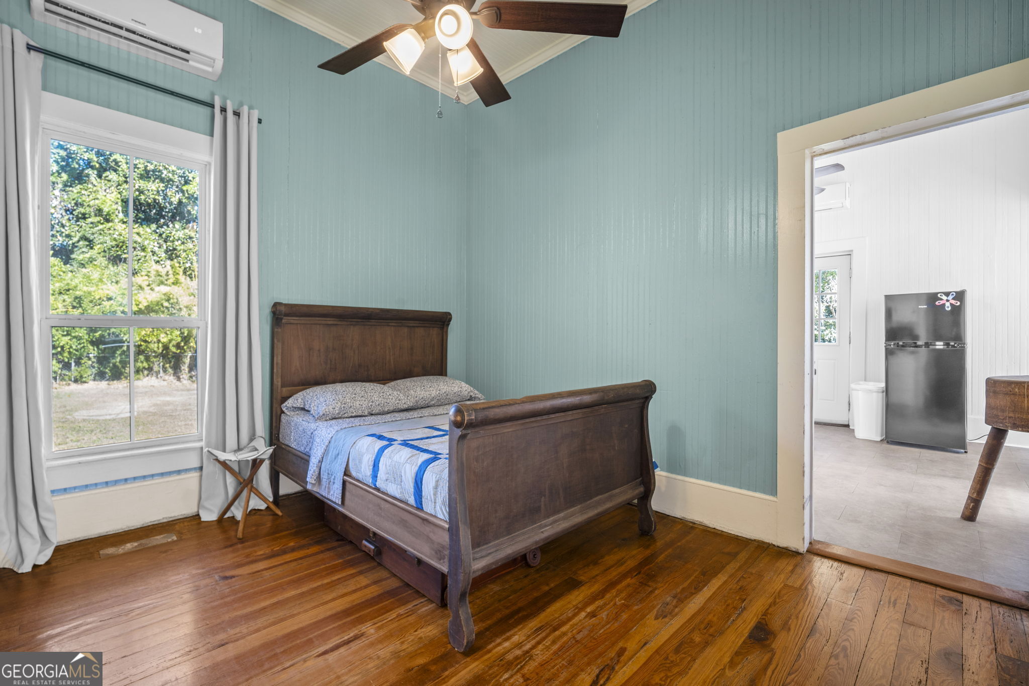 295 South Lewis Street Metter, GA 30439 - Photo 12 of 24 a bedroom with a bed and a window