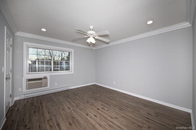 1314 Smithtown Avenue, Unit 29 Bohemia, NY 11716 - Photo 6 of 8 wooden floor in an empty room with a window