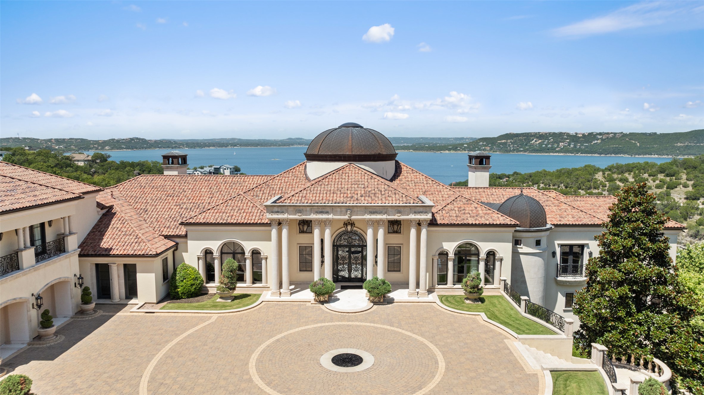 12821 Hughes Park Road Austin, TX 78732 - Photo 2 of 39 Welcome to "Villa Del Lago," a uniquely magnificent estate nestled on over 20 hillside acres of prime south shore lakefront property, offering breathtaking, unobstructed views of Lake Travis.