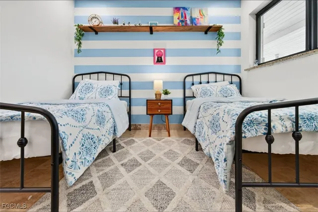 a bedroom with bed and a window