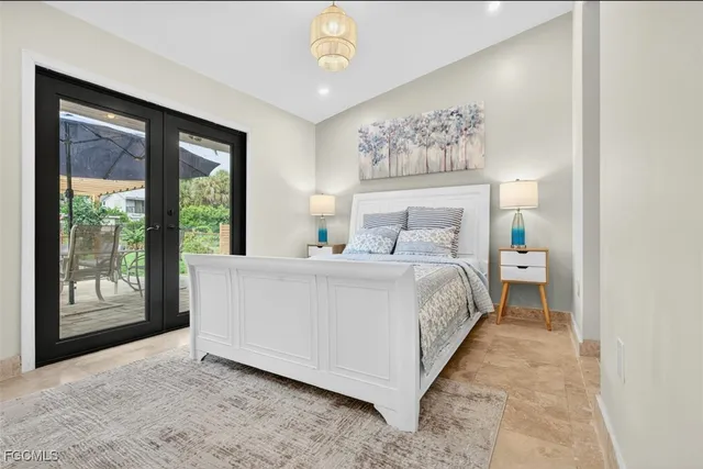 a bed room with a bed and a large window