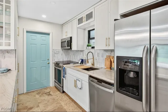 a kitchen with a stove microwave and refrigerator