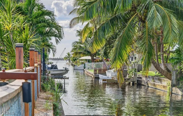 a view of swimming pool with a table and chairs