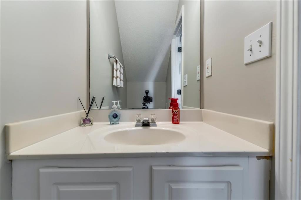 4175 Howell Park Road Duluth, GA 30096 - Photo 12 of 36 a bathroom with a sink and a mirror