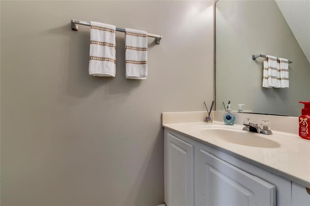 4175 Howell Park Road Duluth, GA 30096 - Photo 13 of 36 a bathroom with a sink and a mirror