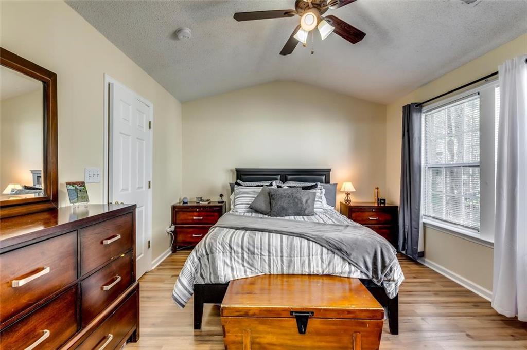 4175 Howell Park Road Duluth, GA 30096 - Photo 15 of 36 a bedroom with a bed and a large window