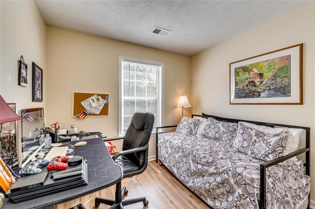 4175 Howell Park Road Duluth, GA 30096 - Photo 19 of 36 a bedroom with bed and a window