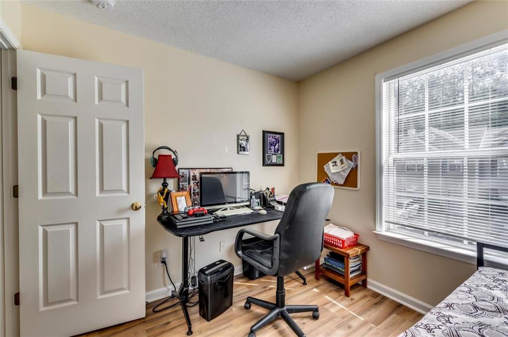 4175 Howell Park Road Duluth, GA 30096 - Photo 20 of 36 a view of a workspace with furniture and a window