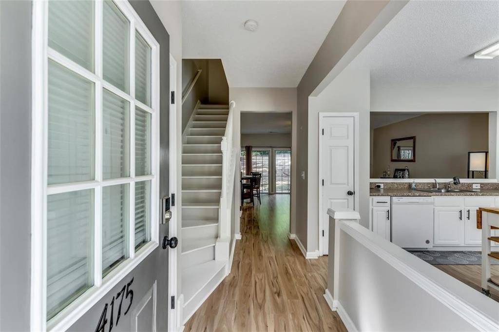 4175 Howell Park Road Duluth, GA 30096 - Photo 2 of 36 a view of a kitchen from the hallway