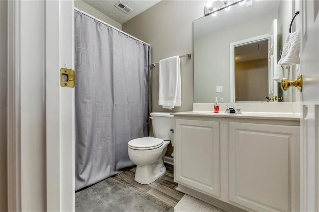 4175 Howell Park Road Duluth, GA 30096 - Photo 21 of 36 a bathroom with a sink toilet and shower