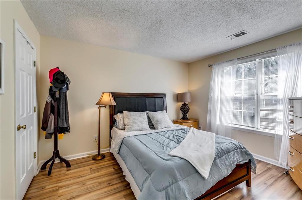 4175 Howell Park Road Duluth, GA 30096 - Photo 22 of 36 a bed room with a bed and a window