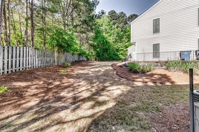 4175 Howell Park Road Duluth, GA 30096 - Photo 25 of 36 a backyard of a house with lots of green space
