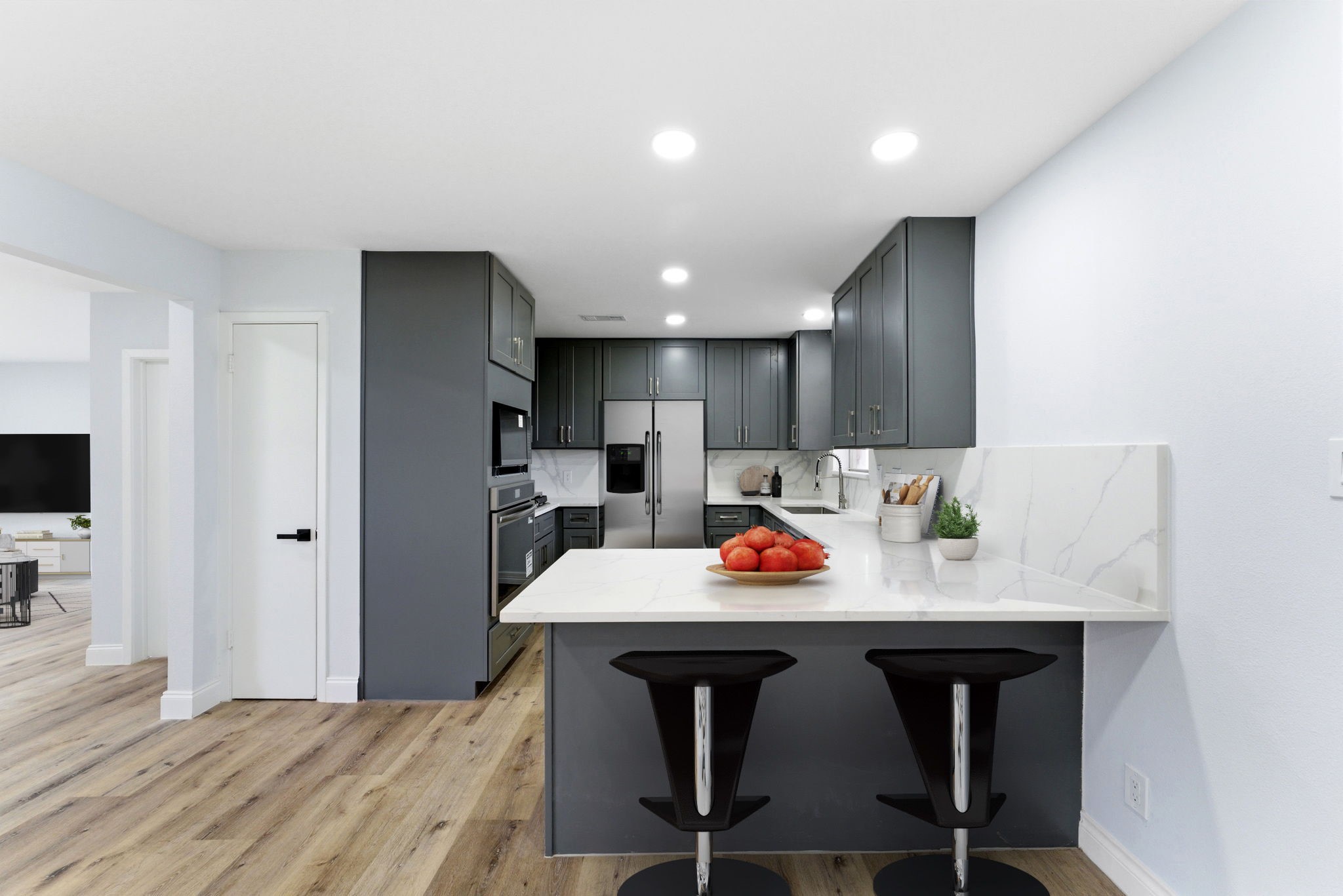 910 Beaver Bend Road Houston, TX 77088 - Photo 16 of 48 a view of kitchen with cabinets and wooden floor