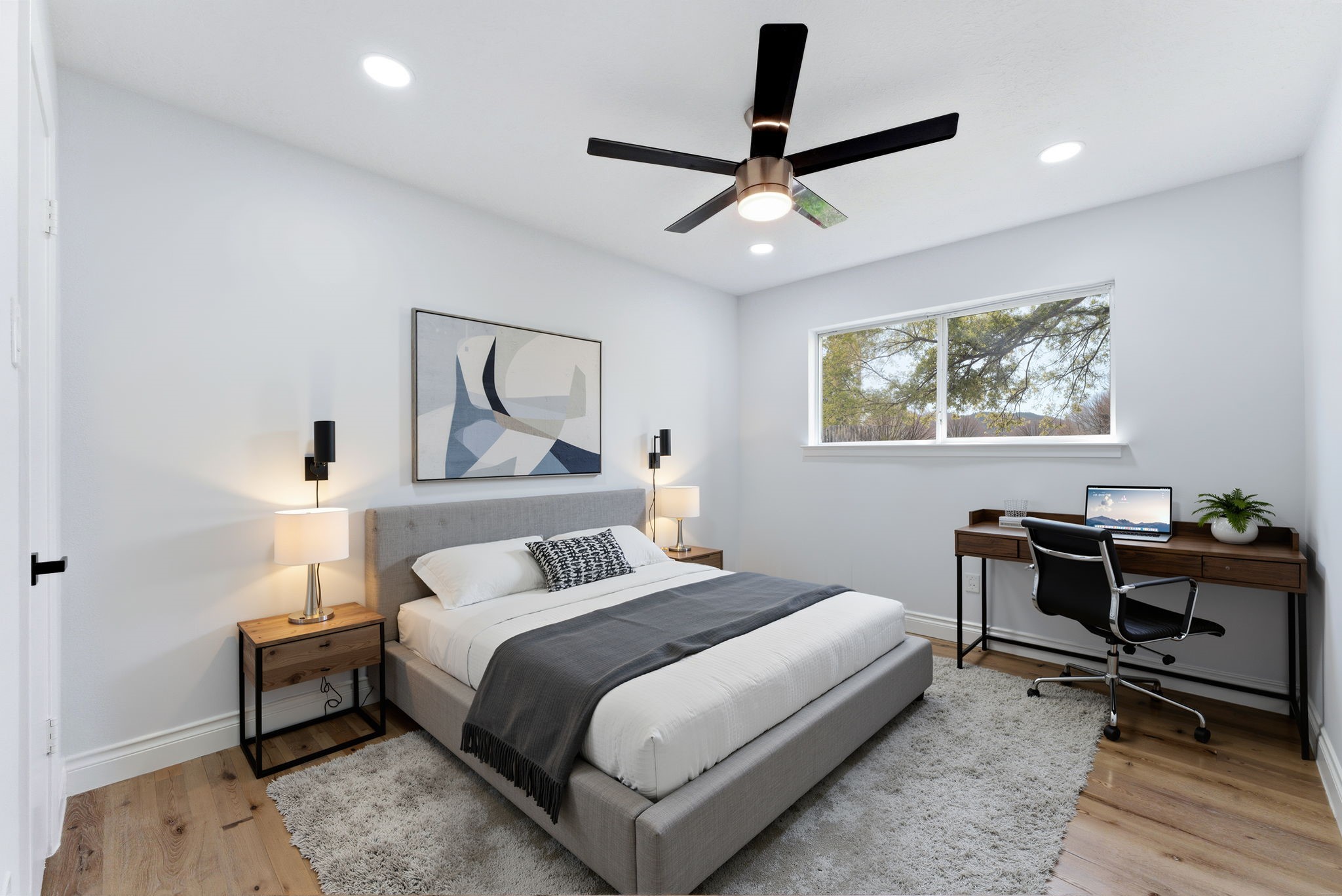 910 Beaver Bend Road Houston, TX 77088 - Photo 21 of 48 A perfect blend of rest and productivity, this bedroom offers a cozy place to unwind along with a dedicated workspace for those work-from-home days. **Virtually Staged**