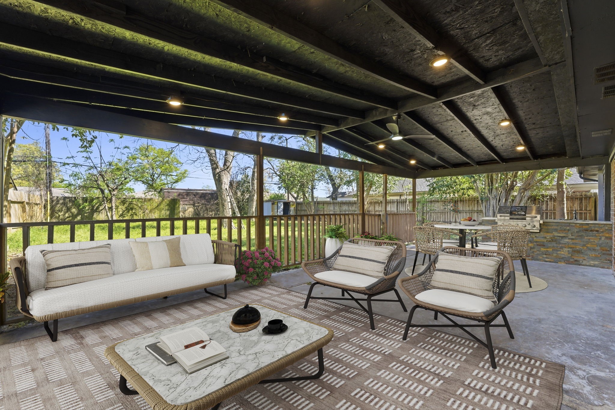 910 Beaver Bend Road Houston, TX 77088 - Photo 27 of 48 This is where evenings slow down. Comfortable seating, soft lighting, and a covered setting that makes outdoor living enjoyable year-round. **Virtually Staged**