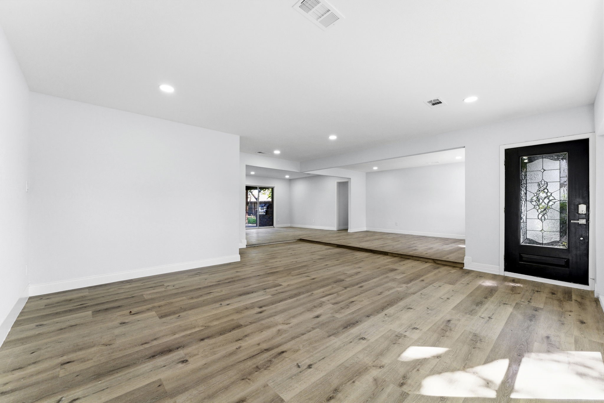 910 Beaver Bend Road Houston, TX 77088 - Photo 34 of 48 Expansive open-concept living space offering endless possibilities for entertaining, relaxing, or gathering with family and friends.