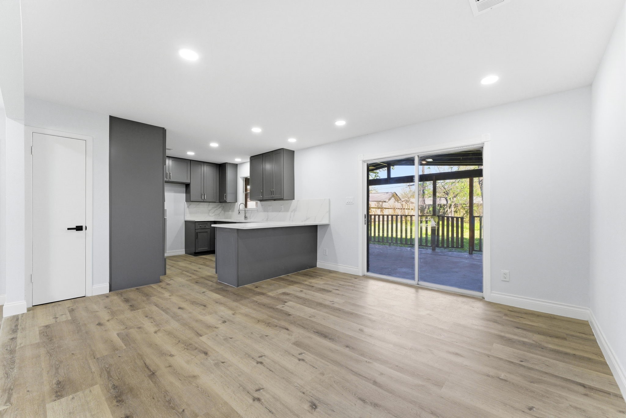 910 Beaver Bend Road Houston, TX 77088 - Photo 40 of 48 This is where it all comes together. A sleek, modern kitchen overlooking an open living space that keeps everyone connected.