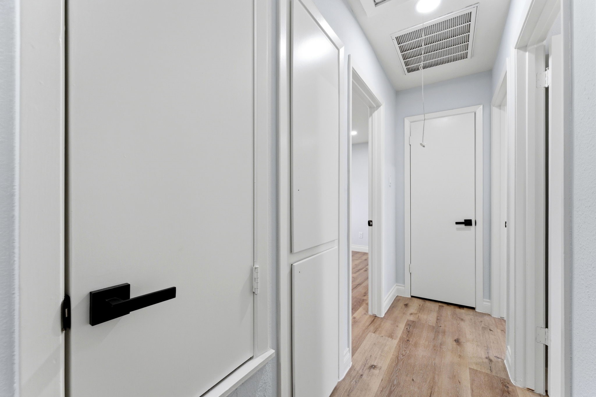 910 Beaver Bend Road Houston, TX 77088 - Photo 41 of 48 a view of a hallway with wooden floor