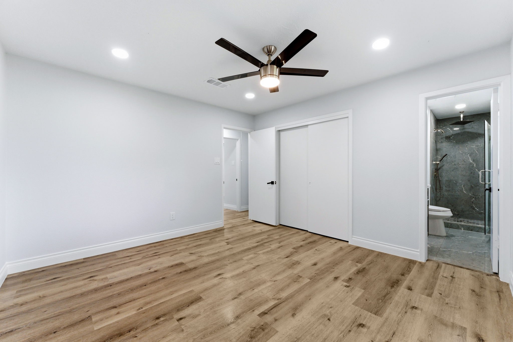 910 Beaver Bend Road Houston, TX 77088 - Photo 44 of 48 Your private escape awaits in this spacious primary suite, complete with easy access to the beautifully updated bathroom.