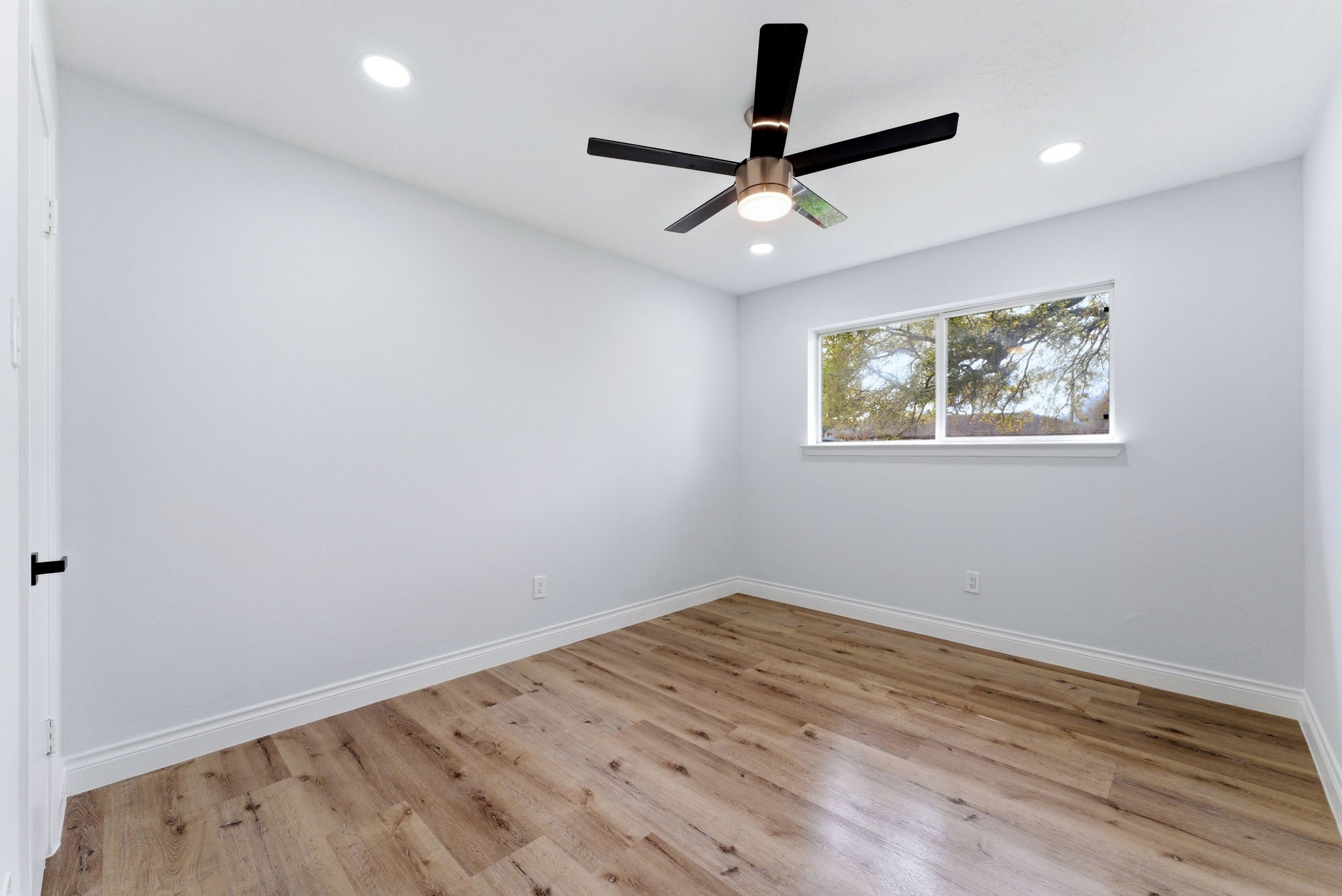910 Beaver Bend Road Houston, TX 77088 - Photo 45 of 48 A calm and comfortable bedroom retreat where soft natural light and modern finishes create the perfect place to relax and recharge.