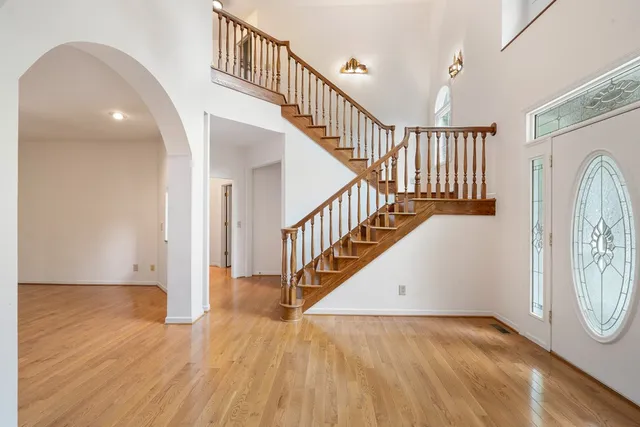 a spacious bathroom with a sink mirror and a shower