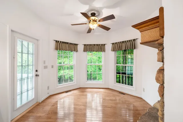 a view of an empty room with a chandelier