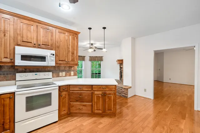 a view of a livingroom with furniture and a window