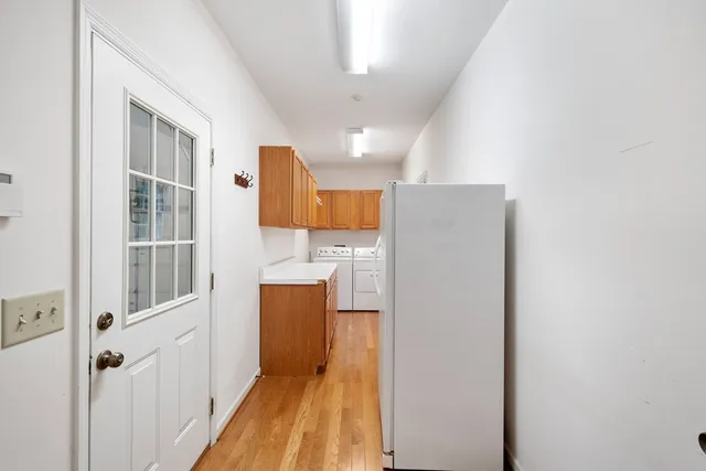 a view of a house with a wooden deck