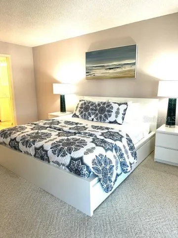 a room with a window and a bed