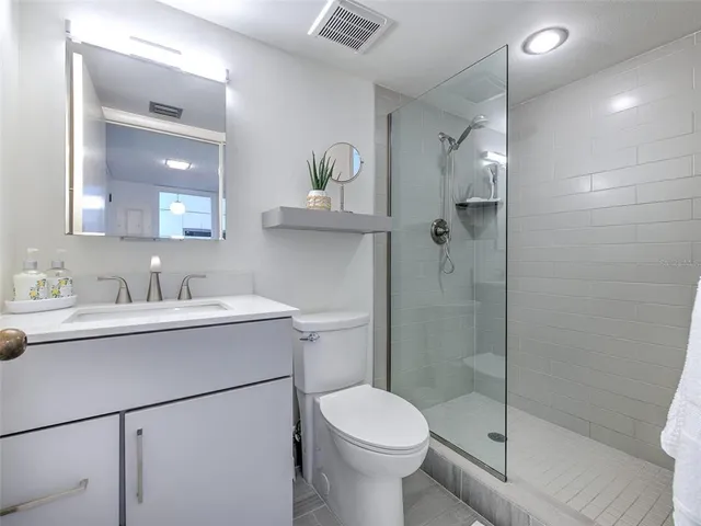 a dining room with furniture and a floor to ceiling window