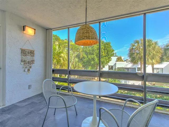 a view of a chairs and table in a patio