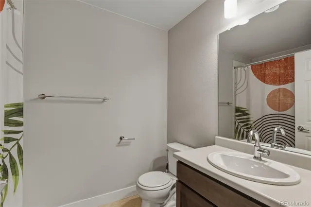 a bedroom with a bed and a potted plant