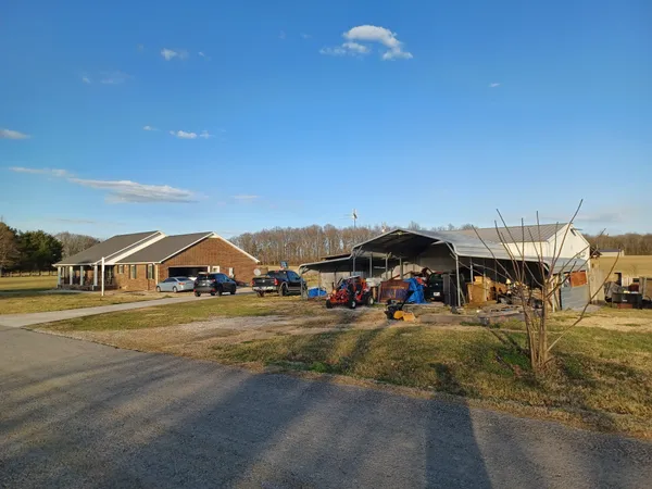 a view of a town with lawn chairs and couches