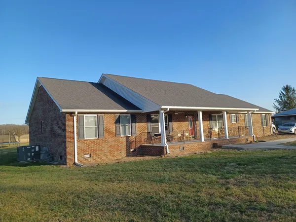 front view of a house with a yard