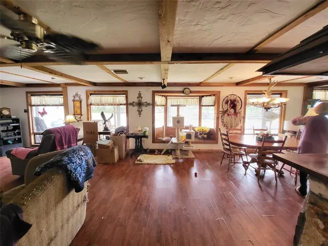 a large kitchen with a stove a sink dishwasher and a microwave oven