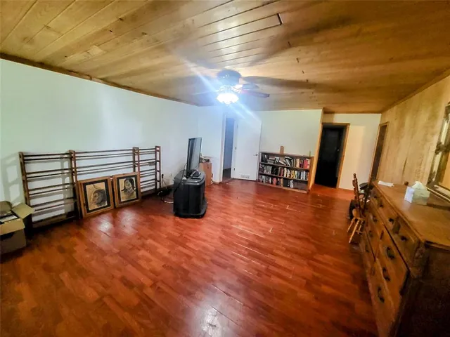 a view of a chairs and table in the balcony