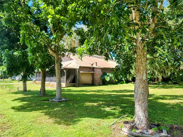a utility room with lots of wooden furniture and a shower