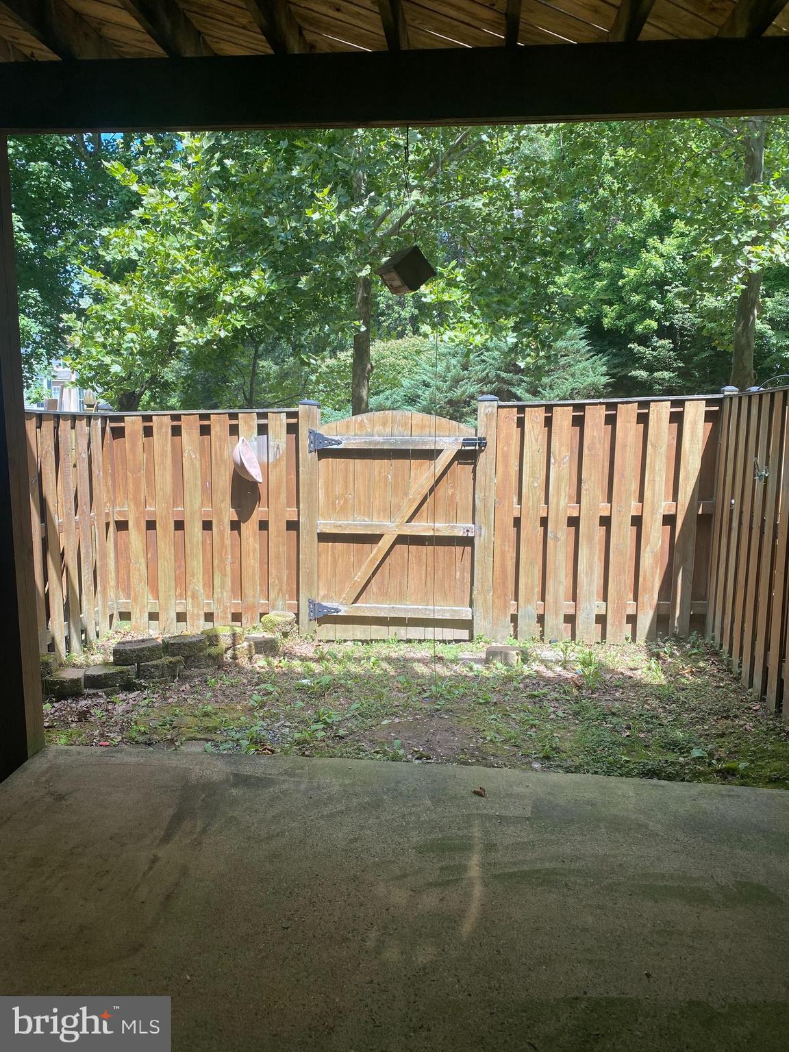 12307 Newcastle Loop Woodbridge, VA 22192 - Photo 12 of 15 Fenced yard backing to trees