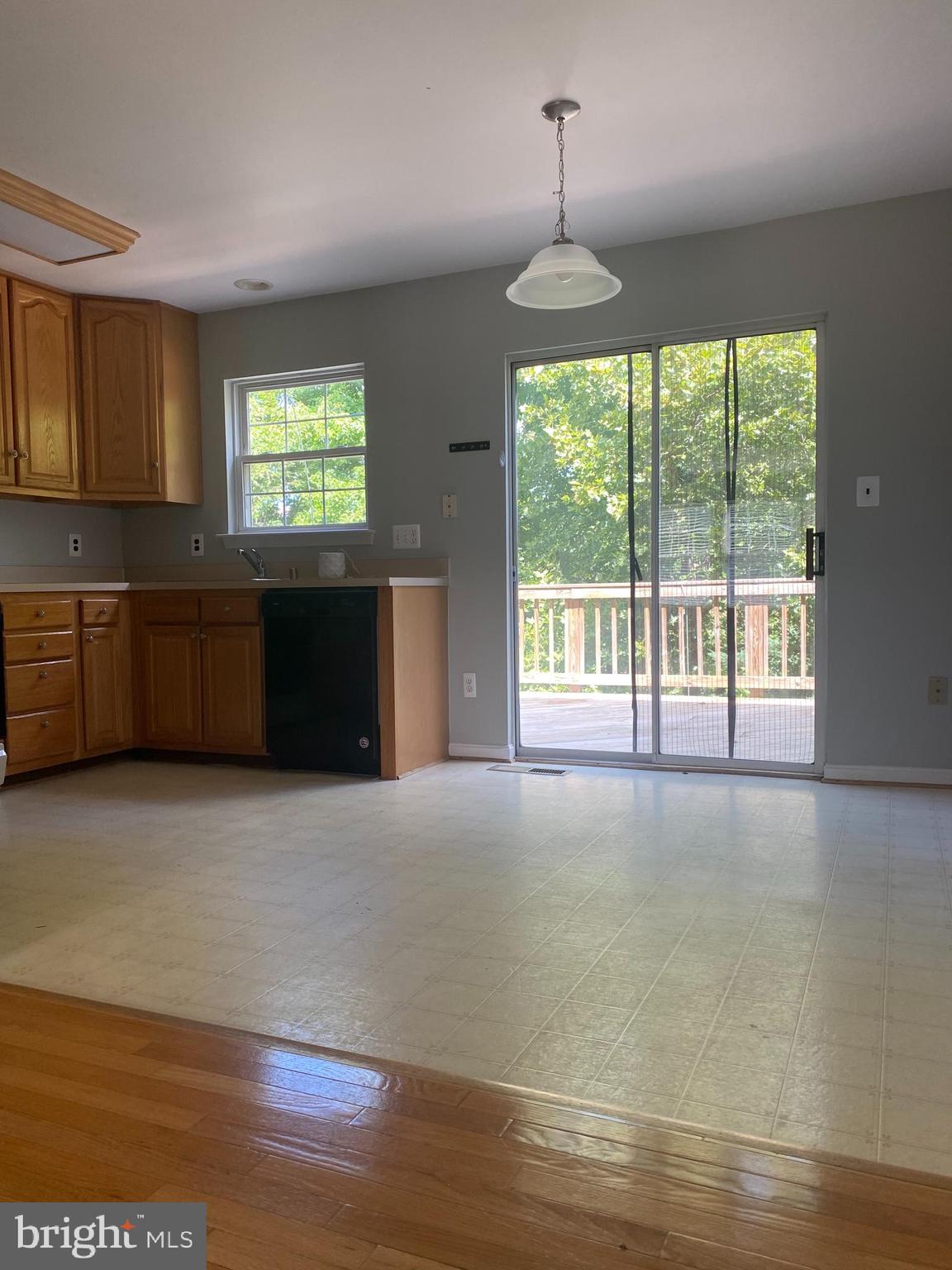 12307 Newcastle Loop Woodbridge, VA 22192 - Photo 4 of 15 Kitchen walks out to deck backing to treed privacy