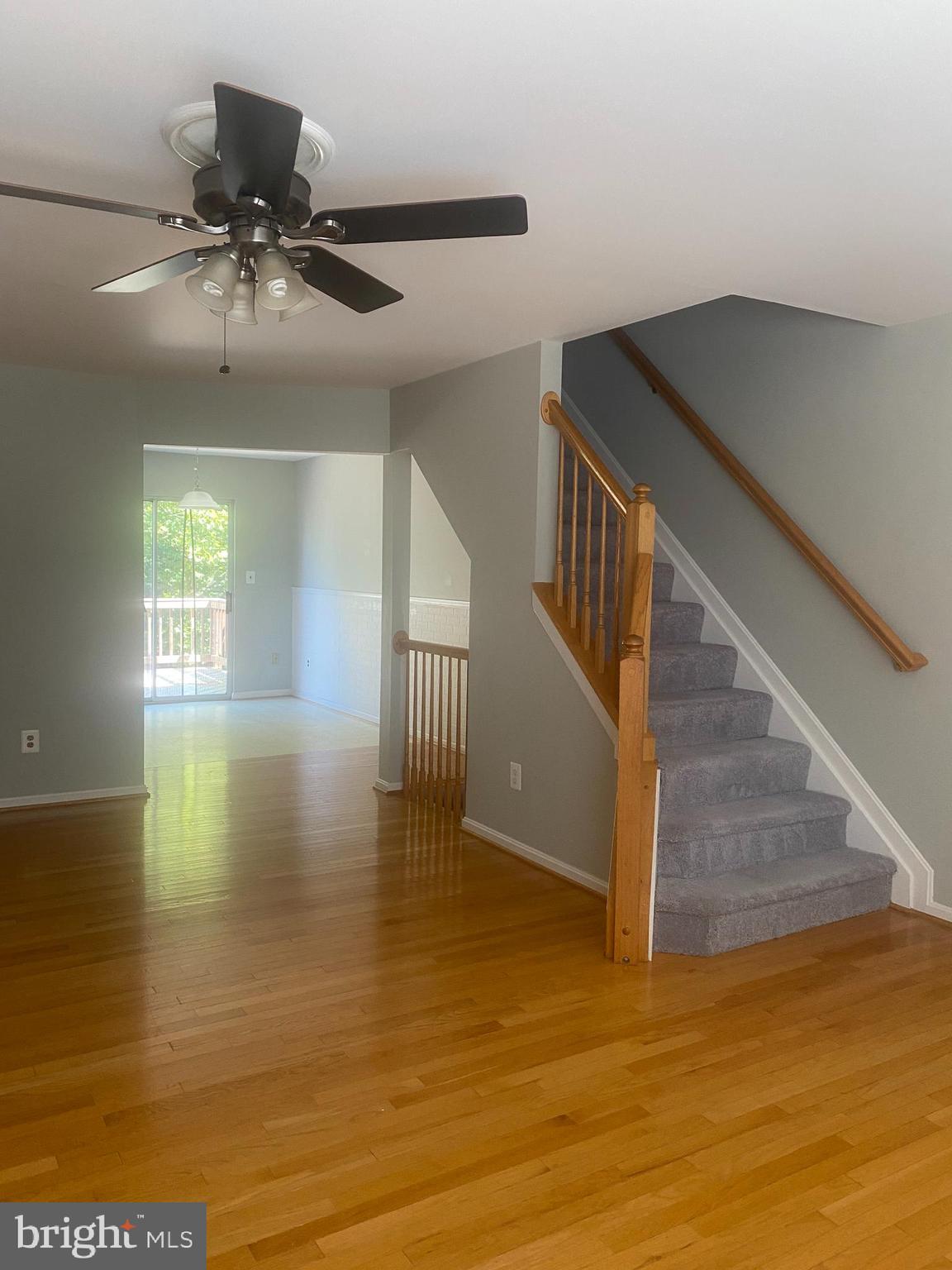 12307 Newcastle Loop Woodbridge, VA 22192 - Photo 6 of 15 Living rm with view of deck, stairs to upper LVL