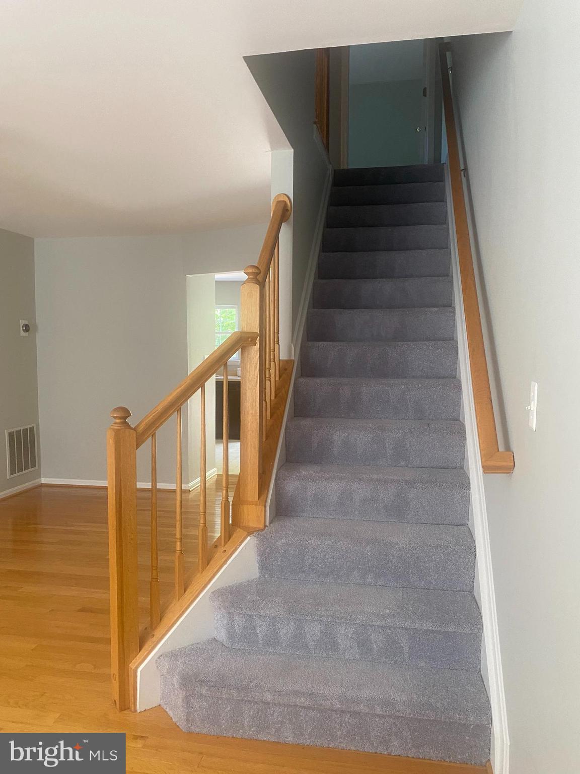 12307 Newcastle Loop Woodbridge, VA 22192 - Photo 7 of 15 Hardwood floors matching hardwood railings