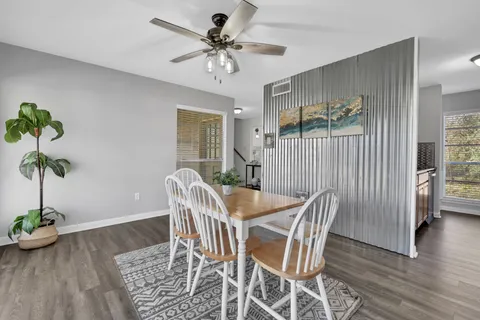 a view of a dining room with furniture window and wooden floor