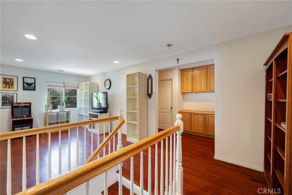 3819 St Austell Way Perris, CA 92571 - Photo 22 of 64 a view of a hallway with wooden floor and windows