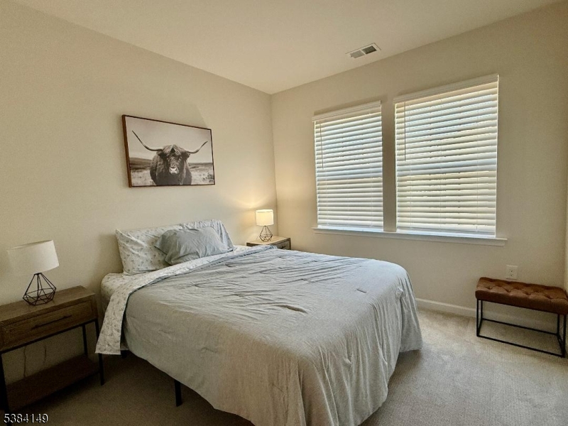 13 Sternadori Road Somerville, NJ 08876 - Photo 11 of 18 a bedroom with a bed and a window